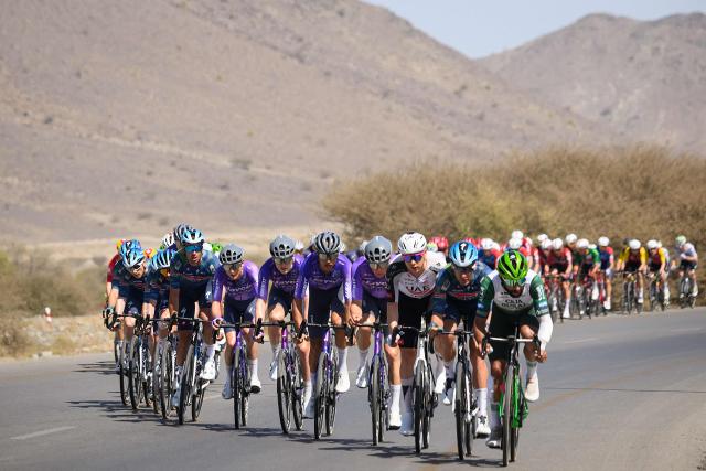 The pack rides during the 5th and last stage of the Tour of Oman cycling race from Nizwa to Green Mountain, on February 11, 2026. (Photo by Loic VENANCE / AFP)
