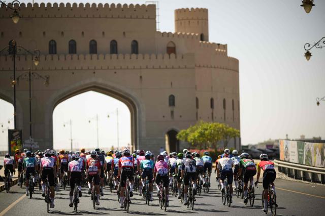 The pack rides during the 5th and last stage of the Tour of Oman cycling race from Nizwa to Green Mountain, on February 11, 2026. (Photo by Loic VENANCE / AFP)
