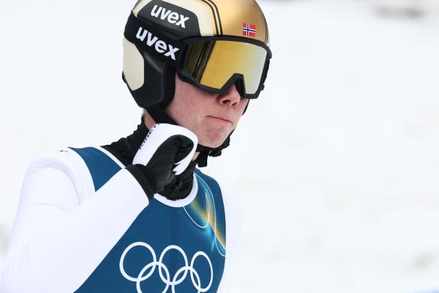 Norway's Jens Luraas Oftebro reacts after a jump in the competition round of the ski jumping of the nordic combined individual Gundersen normal hill/10km event at Predazzo Ski Jumping Stadium in Predazzo (Val di Fiemme) during the Milano Cortina 2026 Winter Olympic Games on February 11, 2026. (Photo by Anne-Christine POUJOULAT / AFP)