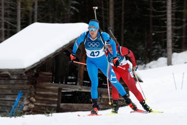 Italy's Dorothea Wierer (L) and Switzerland's Lena Haecki-Gross ski in the women's biathlon 15km individual event during the Milano Cortina 2026 Winter Olympic Games at the Anterselva Biathlon Arena (Sudtirol Arena) in Anterselva (Val Pusteria) on February 11, 2026. (Photo by Odd ANDERSEN / AFP)
