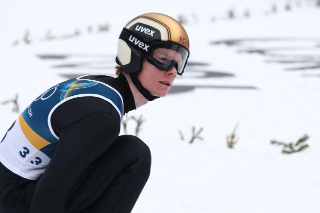 Norway's Einar Luraas Oftebro reacts after a jump in the competition round of the ski jumping of the nordic combined individual Gundersen normal hill/10km event at Predazzo Ski Jumping Stadium in Predazzo (Val di Fiemme) during the Milano Cortina 2026 Winter Olympic Games on February 11, 2026. (Photo by Anne-Christine POUJOULAT / AFP)