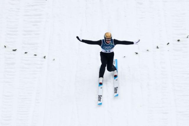 Norway's Einar Luraas Oftebro lands after jumping in the competition round of the ski jumping of the nordic combined individual Gundersen normal hill/10km event at Predazzo Ski Jumping Stadium in Predazzo (Val di Fiemme) during the Milano Cortina 2026 Winter Olympic Games on February 11, 2026. (Photo by Anne-Christine POUJOULAT / AFP)