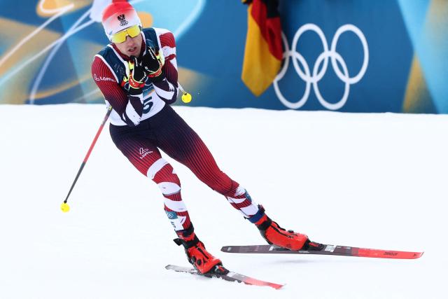 Austria's Stefan Rettenegger competes in the cross-country of the nordic combined individual Gundersen normal hill/10km event at Tesero Cross Country Stadium at Lago di Tesero (Val di Fiemme) during the Milano Cortina 2026 Winter Olympic Games on February 11, 2026. (Photo by Anne-Christine POUJOULAT / AFP)