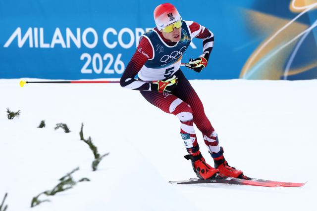 Austria's Stefan Rettenegger competes in the cross-country of the nordic combined individual Gundersen normal hill/10km event at Tesero Cross Country Stadium at Lago di Tesero (Val di Fiemme) during the Milano Cortina 2026 Winter Olympic Games on February 11, 2026. (Photo by Anne-Christine POUJOULAT / AFP)
