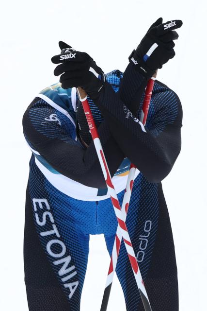 Estonia's Kristjan Ilves reacts after competing in the cross-country of the nordic combined individual Gundersen normal hill/10km event at Tesero Cross Country Stadium at Lago di Tesero (Val di Fiemme) during the Milano Cortina 2026 Winter Olympic Games on February 11, 2026. (Photo by Anne-Christine POUJOULAT / AFP)