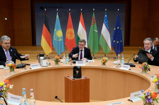 German Foreign Minister Johann Wadephul (C), Kazakh Foreign Minister Yermek Kosherbayev (L) and the Foreign Minister of Kyrgyzstan Jeenbek Kulubayev have taken their seats for a meeting with the Foreign Ministers of Central Asian countries Turkmenistan, Tajikistan, Kyrgyzstan, Uzbekistan and Kazakhstan, on February 11, 2026 in Berlin. (Photo by RALF HIRSCHBERGER / AFP)