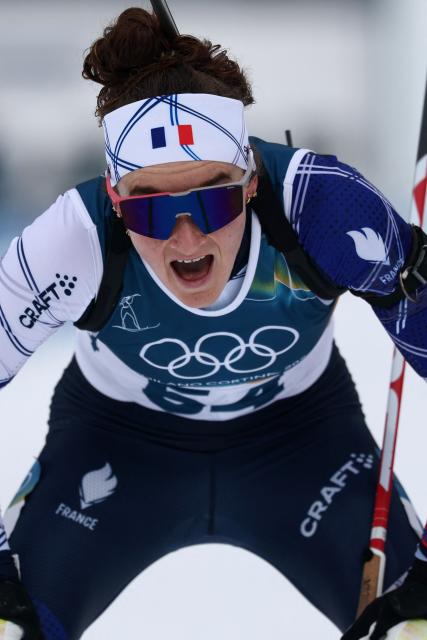 France's Lou Jeanmonnot reacts after the finish line in the women's biathlon 15km individual event during the Milano Cortina 2026 Winter Olympic Games at the Anterselva Biathlon Arena (Sudtirol Arena) in Anterselva (Val Pusteria) on February 11, 2026. (Photo by FRANCK FIFE / AFP)