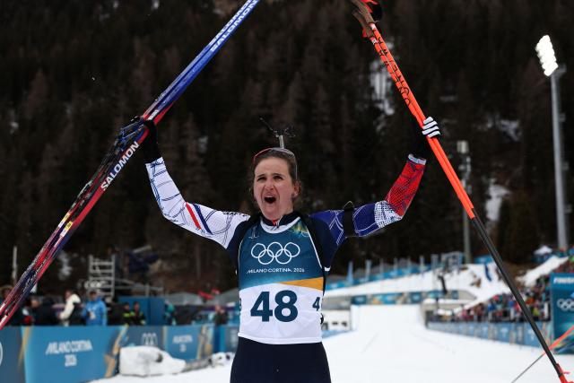 TOPSHOT - France's Julia Simon reacts after the finish line in the women's biathlon 15km individual event during the Milano Cortina 2026 Winter Olympic Games at the Anterselva Biathlon Arena (Sudtirol Arena) in Anterselva (Val Pusteria) on February 11, 2026. (Photo by FRANCK FIFE / AFP)