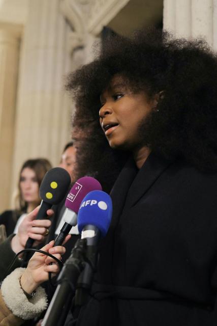 Assa Traore addresses media after attending a hearing of France's top court on the dismissal of an investigation into the 2016 death of her brother Adama Traore in police custody at Paris' courthouse on February 11, 2026. The lawyer for Adama Traorй’s family, Me Yassine Bouzrou, announced that he would petition the European Court of Human Rights (ECHR) “to have France sentenced,” after the case was dismissed on February 11, 2026 by the Court of Cassation. (Photo by Thomas SAMSON / AFP)