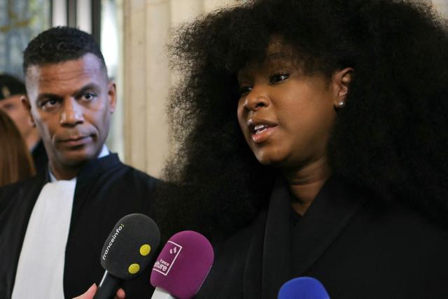 Assa Traore (R) next to French lawyer Yassine Bouzrou addresses media after attending a hearing of France's top court on the dismissal of an investigation into the 2016 death of her brother Adama Traore in police custody at Paris' courthouse on February 11, 2026. The lawyer for Adama Traorй’s family, Me Yassine Bouzrou, announced that he would petition the European Court of Human Rights (ECHR) “to have France sentenced,” after the case was dismissed on February 11, 2026 by the Court of Cassation. (Photo by Thomas SAMSON / AFP)