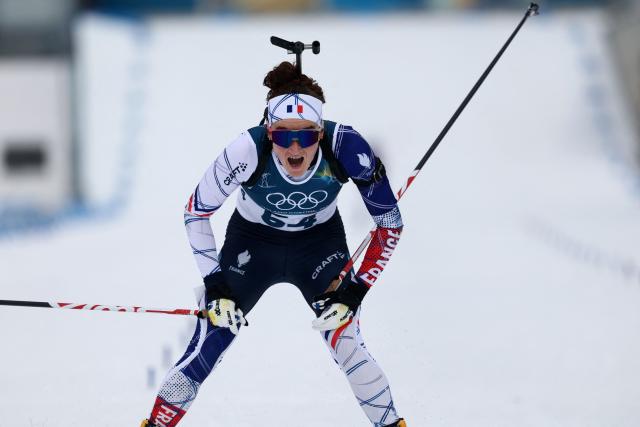 France's Lou Jeanmonnot reacts after the finish line in the women's biathlon 15km individual event during the Milano Cortina 2026 Winter Olympic Games at the Anterselva Biathlon Arena (Sudtirol Arena) in Anterselva (Val Pusteria) on February 11, 2026. (Photo by FRANCK FIFE / AFP)