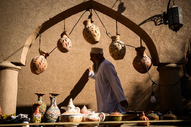 An old man walks in the souk of Nizwa, prior to the presentation of the 5th and last stage of the Tour of Oman cycling race from Nizwa to Green Mountain, on February 11, 2026. (Photo by Loic VENANCE / AFP)
