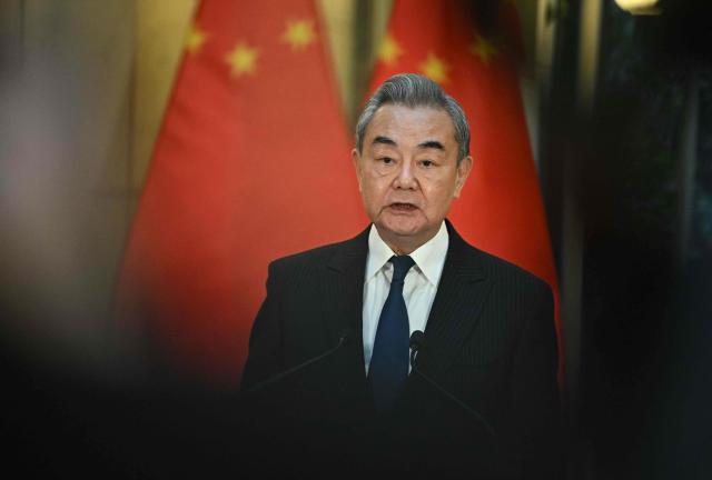 Chinese Foreign Minister Wang Yi speaks during a joint press conference with the Hungarian Foreign and Trade Minister in Budapest, Hungary, on February 11, 2026. (Photo by Attila KISBENEDEK / AFP)
