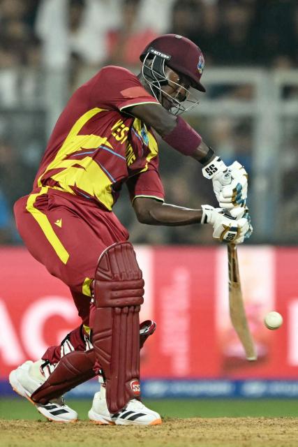 West Indies' Sherfane Rutherford plays a shot during the 2026 ICC Men's T20 Cricket World Cup group stage match between England and West Indies at the Wankhede Stadium in Mumbai on February 11, 2026. (Photo by Indranil MUKHERJEE / AFP)