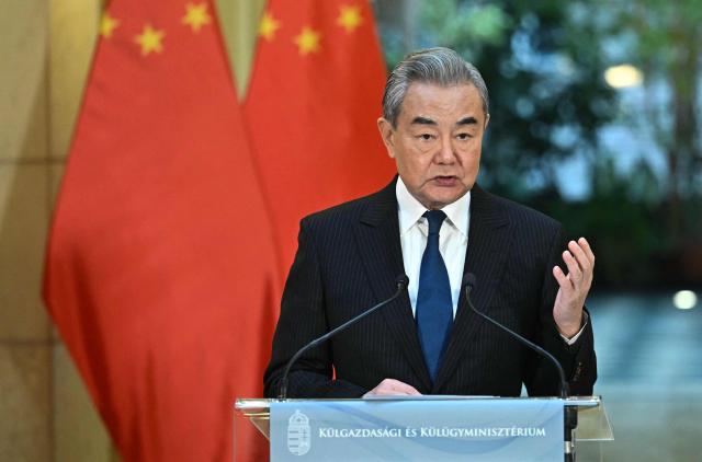 Chinese Foreign Minister Wang Yi speaks during a joint press conference with the Hungarian Foreign and Trade Minister in Budapest, Hungary, on February 11, 2026. (Photo by Attila KISBENEDEK / AFP)