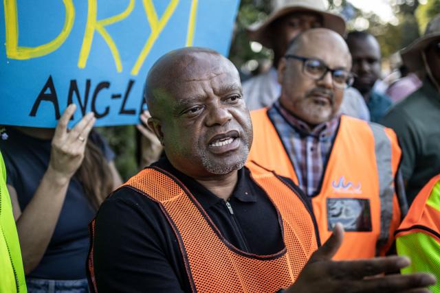 Johannesburg Executive Mayor Dada Morero speaks to protesters as they demonstrate against water restriction in Johannesburg, on February 11, 2026. Several parts of South Africa's economic capital -- from wealthy areas to the poorer ones -- have been gripped by weeks-long water shortages as decades of infrastructural decay and lack of maintenance push the system to the brink.
In other areas of the country, including the southern city of Cape Town, shortages due to prolonged droughts were last week declared a national disaster.
This meant restrictions could be imposed to avoid a dreaded "Day Zero", when the taps run dry. (Photo by ILARIA FINIZIO / AFP)