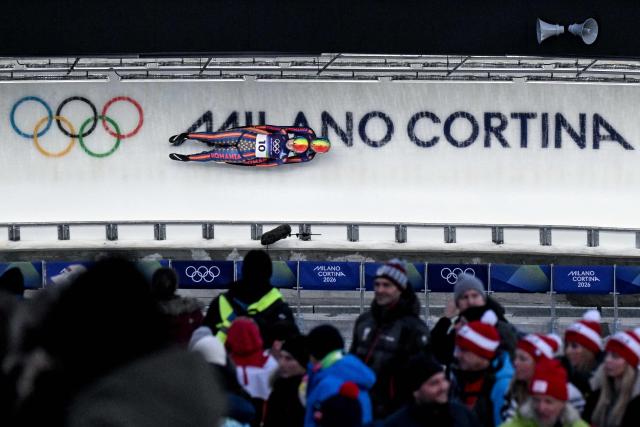 Romania's Raluca Stramaturaru and Romania's Mihaela-Carmen Manolescu compete in the luge women's doubles run 1 at Cortina Sliding Centre during the Milano Cortina 2026 Winter Olympic Games in Cortina d'Ampezzo on February 11, 2026. (Photo by Tiziana FABI / AFP)