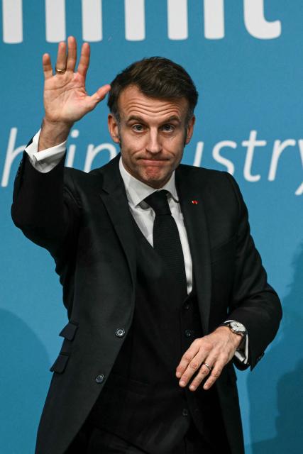 France's President Emmanuel Macron waves after delivering a speech during the European Industry Summit in Antwerp on February 11, 2026. (Photo by NICOLAS TUCAT / AFP)