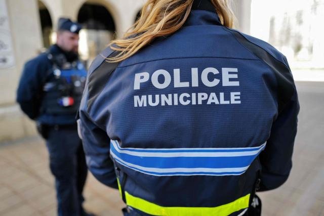 Local police officers stand guard in Montpellier, southern France on February 11, 2026. The city of Montpellier issued a decree on November 2025 banning the use of electric scooters and similar vehicles in the Place de la Comédie, the Antigone district, and the main pedestrian streets of the historic center. (Photo by Sylvain THOMAS / AFP)