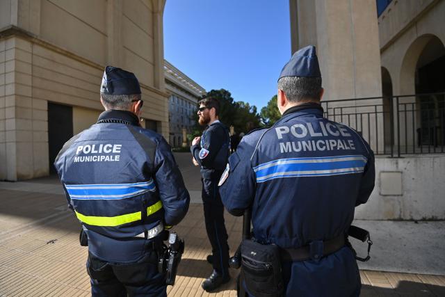 Local police officers stand guard in Montpellier, southern France on February 11, 2026. The city of Montpellier issued a decree on November 2025 banning the use of electric scooters and similar vehicles in the Place de la Comédie, the Antigone district, and the main pedestrian streets of the historic center. (Photo by Sylvain THOMAS / AFP)