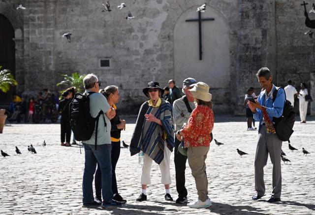 Tourists visit Havana on February 11, 2026. (Photo by YAMIL LAGE / AFP)
