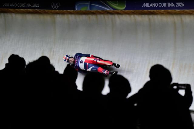 USA's Zachary Digregorio and Sean Hollander compete in the luge men's doubles run 1 at Cortina Sliding Centre during the Milano Cortina 2026 Winter Olympic Games in Cortina d'Ampezzo on February 11, 2026. (Photo by Stefano RELLANDINI / AFP)