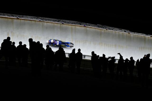 Ukraine's Ihor Hoi and Kachmar Nazarii compete in the luge men's doubles run 1 at Cortina Sliding Centre during the Milano Cortina 2026 Winter Olympic Games in Cortina d'Ampezzo on February 11, 2026. (Photo by Stefano RELLANDINI / AFP)
