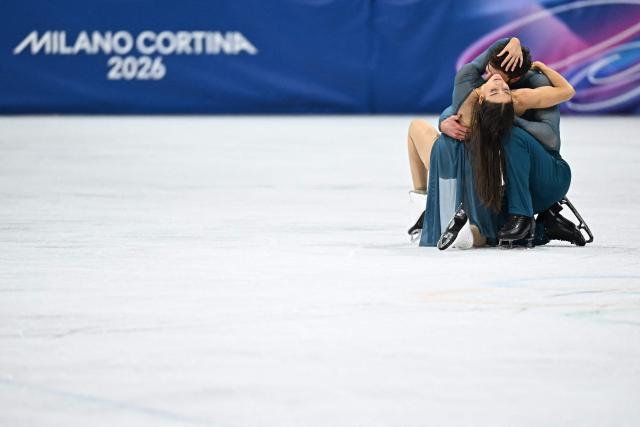 France's Laurence Fournier Beaudry (L) and France's Guillaume Cizeron warm up before the figure skating ice dance-free dance final during the Milano Cortina 2026 Winter Olympic Games at Milano Ice Skating Arena in Milan on February 11, 2026. (Photo by Gabriel BOUYS / AFP)
