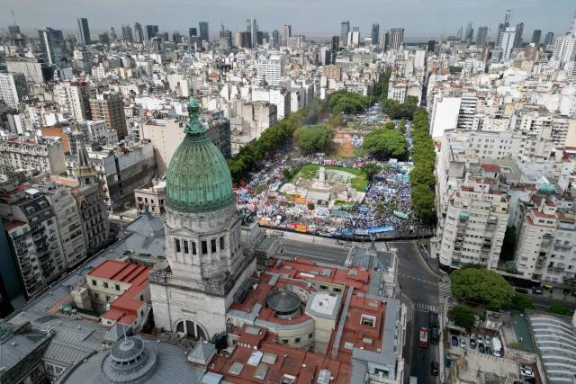 In this aerial view trade unionists protest against the labor reform debate taking place in the National Congress in Buenos Aires, on February 11, 2026. (Photo by Luis ROBAYO / AFP)