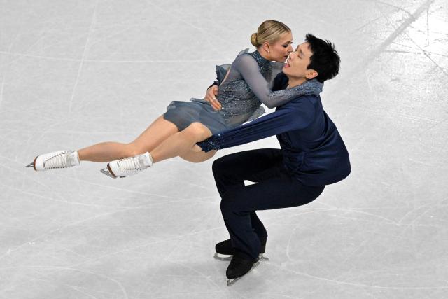 Australia's Holly Harris and Australia's Jason Chan compete in the figure skating ice dance-free dance final during the Milano Cortina 2026 Winter Olympic Games at Milano Ice Skating Arena in Milan on February 11, 2026. (Photo by Antonin THUILLIER / AFP)