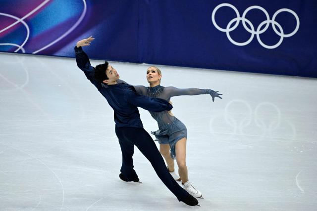 Australia's Holly Harris and Jason Chan compete in the figure skating ice dance-free dance final during the Milano Cortina 2026 Winter Olympic Games at Milano Ice Skating Arena in Milan on February 11, 2026. (Photo by WANG Zhao / AFP)