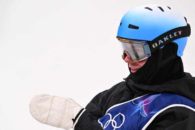 Switzerland's Jonas Hasler reacts after competing in the snowboard men's halfpipe qualification run 1 during the Milano Cortina 2026 Winter Olympic Games at Livigno Snow Park, in Livigno (Valtellina), on February 11, 2026. (Photo by Kirill KUDRYAVTSEV / AFP)