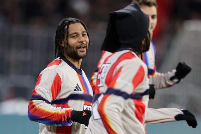 Bayern Munich's players including German forward #07 Serge Gnabry warm up prior to the German Cup (DFB-Pokal) quarter-final football match between FC Bayern Munich and RB Leipzig in Munich, southern Germany on February 11, 2026. (Photo by Alexandra BEIER / AFP) / DFB REGULATIONS PROHIBIT ANY USE OF PHOTOGRAPHS AS IMAGE SEQUENCES AND QUASI-VIDEO.