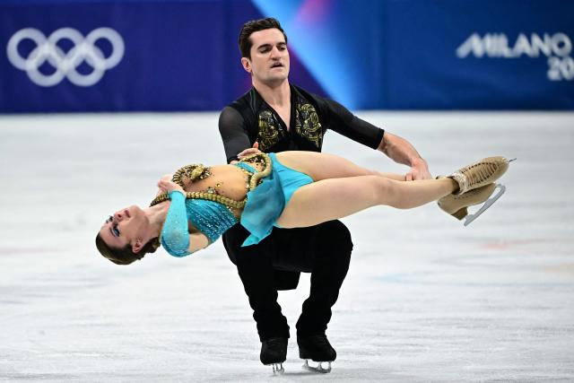 Canada's Romain Le Gac and Canada's Marie-Jade Lauriault compete in the figure skating ice dance-free dance final during the Milano Cortina 2026 Winter Olympic Games at Milano Ice Skating Arena in Milan on February 11, 2026. (Photo by JULIEN DE ROSA / AFP)