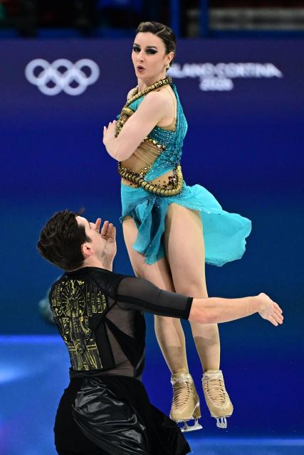 Canada's Romain Le Gac and Canada's Marie-Jade Lauriault compete in the figure skating ice dance-free dance final during the Milano Cortina 2026 Winter Olympic Games at Milano Ice Skating Arena in Milan on February 11, 2026. (Photo by JULIEN DE ROSA / AFP)