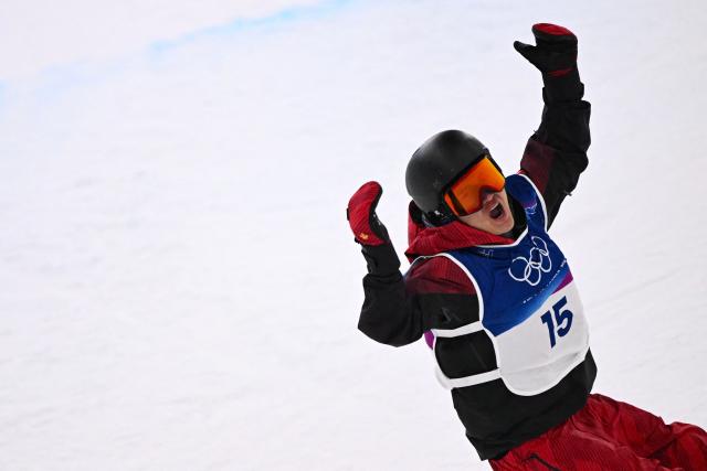 China's Wang Ziyang reacts after competing in the snowboard men's halfpipe qualification run 2 during the Milano Cortina 2026 Winter Olympic Games at Livigno Snow Park, in Livigno (Valtellina), on February 11, 2026. (Photo by Kirill KUDRYAVTSEV / AFP)