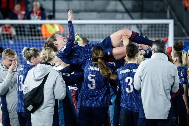 Arsenal’s team celebrates after winning the match at the end of the UEFA Women’s Champions League knockout play-off in first-leg match between Oud-Heverlee Leuven and Arsenal FC at the Den Dreef Stadium in Leuven on February 11, 2026. (Photo by Simon Wohlfahrt / AFP)