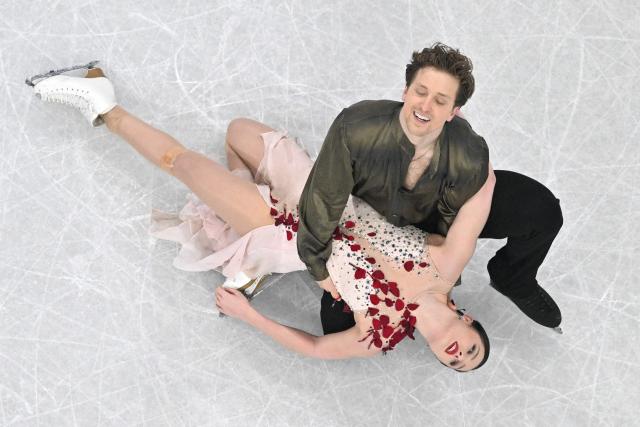 USA's Christina Carreira and USA's Anthony Ponomarenko compete in the figure skating ice dance-free dance final during the Milano Cortina 2026 Winter Olympic Games at Milano Ice Skating Arena in Milan on February 11, 2026. (Photo by Antonin THUILLIER / AFP)
