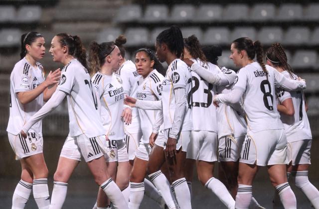 Real Madrid players celebrate after scoring their first goal during the UEFA Women's Champions League knockout round first leg play-off football match between Paris FC and Real Madrid at the Stade Charlety, in Paris, on February 11, 2026. (Photo by Guillaume BAPTISTE / AFP)