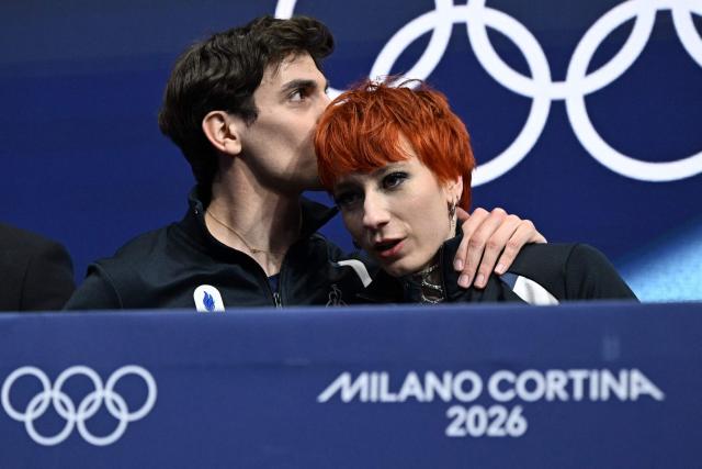 France's Evgeniia Lopareva and France's Geoffrey Brissaud react in the kiss and cry area after competing in the figure skating ice dance-free dance final during the Milano Cortina 2026 Winter Olympic Games at Milano Ice Skating Arena in Milan on February 11, 2026. (Photo by Gabriel BOUYS / AFP)