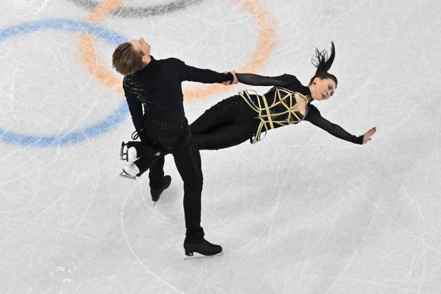 Lithuania's Allison Reed and Lithuania's Saulius Ambrulevicius compete in the figure skating ice dance-free dance final during the Milano Cortina 2026 Winter Olympic Games at Milano Ice Skating Arena in Milan on February 11, 2026. (Photo by Antonin THUILLIER / AFP)