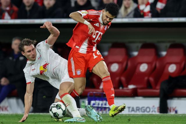 Bayern Munich's Colombian forward #14 Luis Diaz (R) is fouled by Leipzig's Hungarian defender #04 Willi Orban during the German Cup (DFB-Pokal) quarter-final football match between FC Bayern Munich and RB Leipzig in Munich, southern Germany on February 11, 2026. (Photo by Alexandra BEIER / AFP) / DFB REGULATIONS PROHIBIT ANY USE OF PHOTOGRAPHS AS IMAGE SEQUENCES AND QUASI-VIDEO.