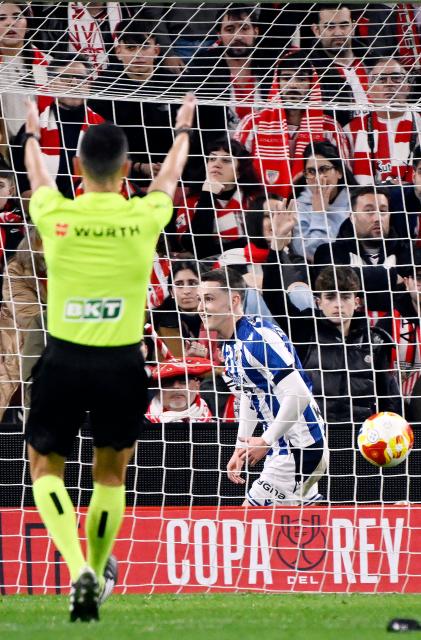 Real Sociedad's Spanish midfielder #08 Benat Turrientes celebrates scoring the opening goal during the Spanish Copa del Rey (King's Cup) semi final first leg football match between Athletic Club Bilbao and Real Sociedad at San Mames Stadium in Bilbao on February 11, 2026. (Photo by ANDER GILLENEA / AFP)