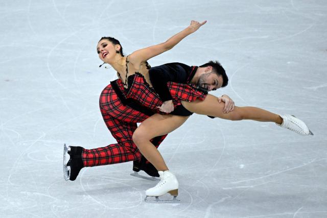 Britain's Lilah Fear and Lewis Gibson compete in the figure skating ice dance-free dance final during the Milano Cortina 2026 Winter Olympic Games at Milano Ice Skating Arena in Milan on February 11, 2026. (Photo by WANG Zhao / AFP)