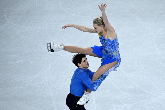 Canada's Paul Poirier and Canada's Piper Gilles compete in the figure skating ice dance-free dance final during the Milano Cortina 2026 Winter Olympic Games at Milano Ice Skating Arena in Milan on February 11, 2026. (Photo by WANG Zhao / AFP)