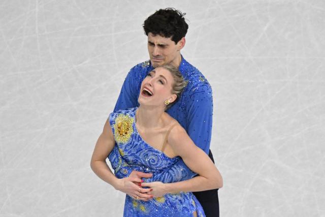 Canada's Piper Gilles and Canada's Paul Poirier react after competing in the figure skating ice dance-free dance final during the Milano Cortina 2026 Winter Olympic Games at Milano Ice Skating Arena in Milan on February 11, 2026. (Photo by Antonin THUILLIER / AFP)