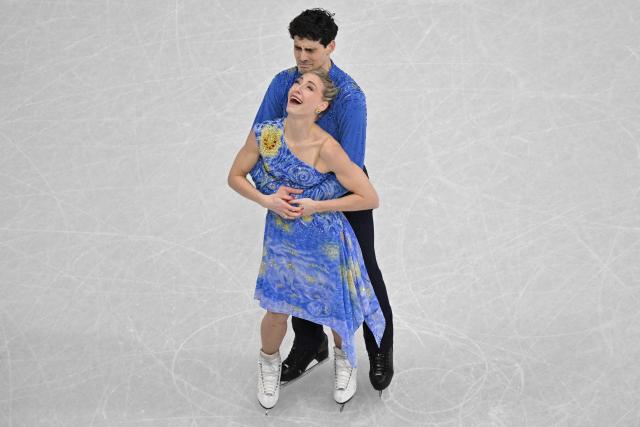 Canada's Piper Gilles and Canada's Paul Poirier react after competing in the figure skating ice dance-free dance final during the Milano Cortina 2026 Winter Olympic Games at Milano Ice Skating Arena in Milan on February 11, 2026. (Photo by Antonin THUILLIER / AFP)