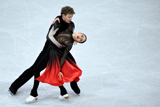 USA's Madison Chock and Evan Bates compete in the figure skating ice dance-free dance final during the Milano Cortina 2026 Winter Olympic Games at Milano Ice Skating Arena in Milan on February 11, 2026. (Photo by WANG Zhao / AFP)