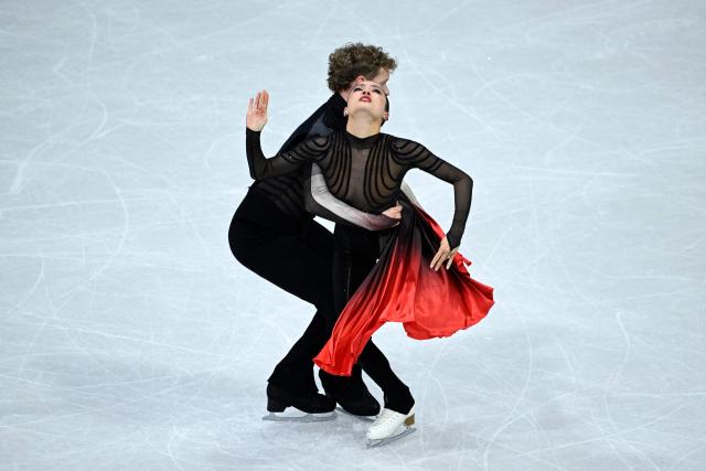 USA's Madison Chock and Evan Bates compete in the figure skating ice dance-free dance final during the Milano Cortina 2026 Winter Olympic Games at Milano Ice Skating Arena in Milan on February 11, 2026. (Photo by WANG Zhao / AFP)