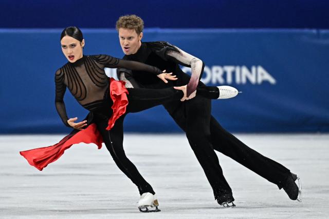 USA's Evan Bates and USA's Madison Chock compete in the figure skating ice dance-free dance final during the Milano Cortina 2026 Winter Olympic Games at Milano Ice Skating Arena in Milan on February 11, 2026. (Photo by Gabriel BOUYS / AFP)